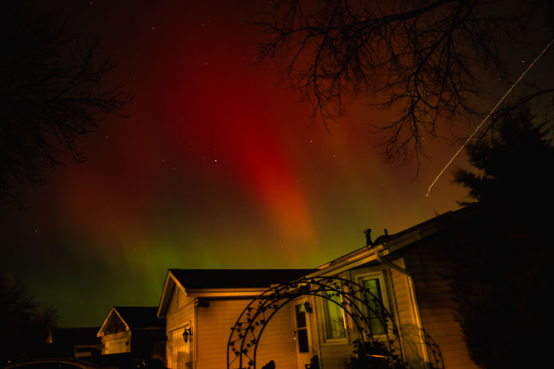 Aurora above Suburban Houses